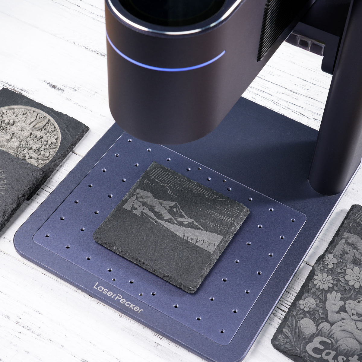 LP4 engraves on the slate coaster with infrared laser.