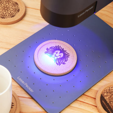LP4 engraves on a cork coaster with blue laser.