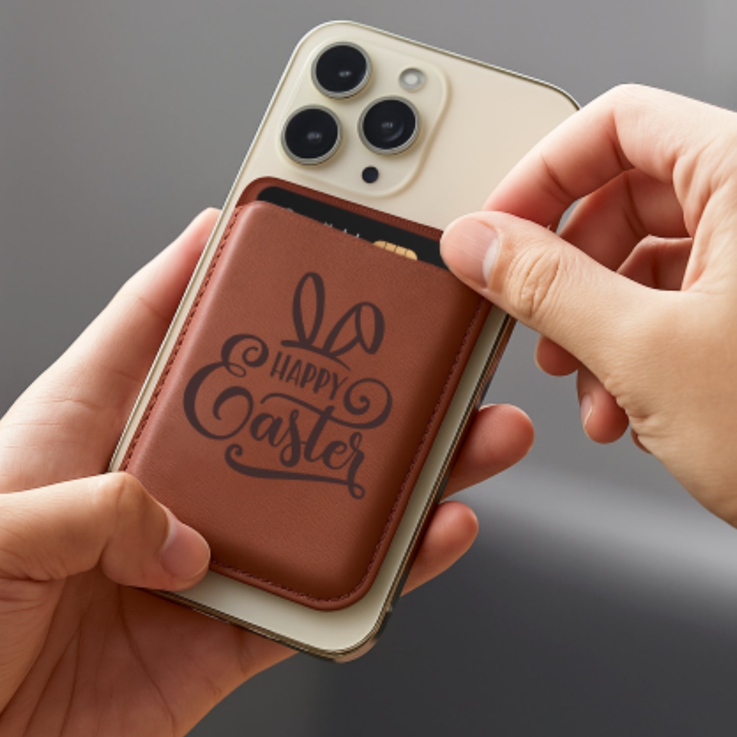 A man pull his credit card from the card holder, which docks firmly on the back side of an iPhone.
