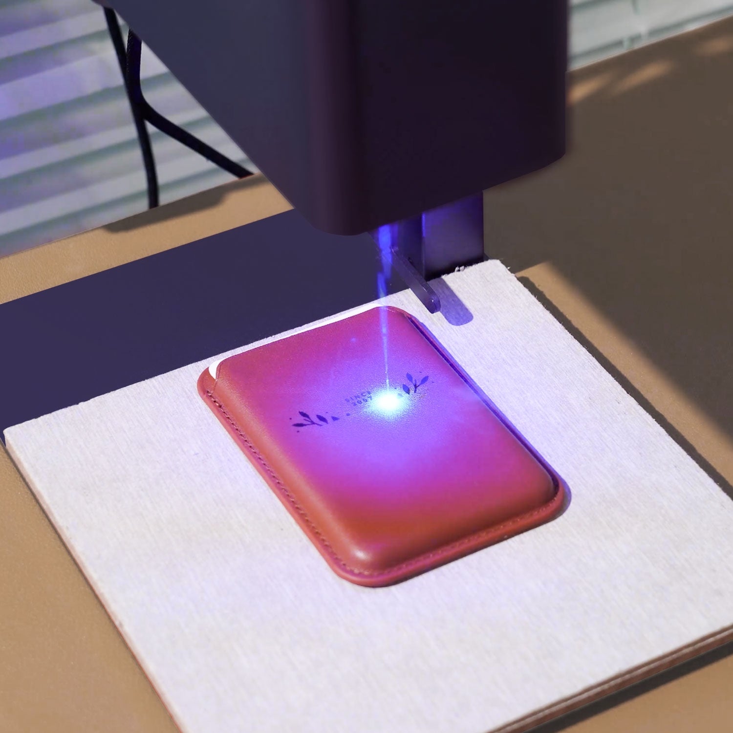 LP2 engraves on the card holder with blue diode laser.
