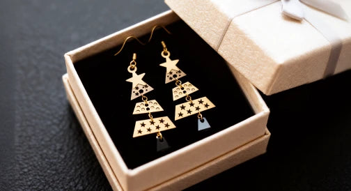 Christmas tree-shaped wooden earrings.