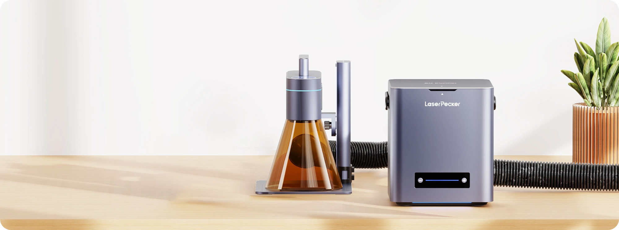 LaserPecker LP4 laser engraver paired with a desktop air purifier for clean indoor air.