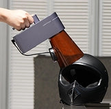 Handheld LaserPecker LP4 engraving at a unique angle on an irregular object.