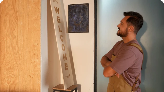 A creator standing in their "DIY playground" with LaserPecker LP2 Plus, ready to build and experiment with pro-level hobby projects and models.
