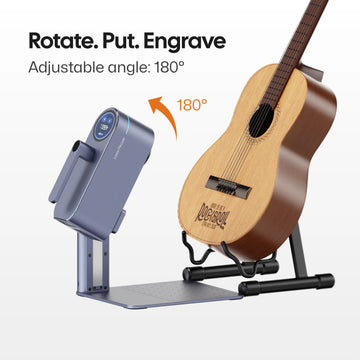 LaserPecker LP4 with 180° adjustable angle, demonstrating engraving on an acoustic guitar. The headline "Rotate. Put. Engrave" highlights the machine's flexibility for curved and angled surfaces.
