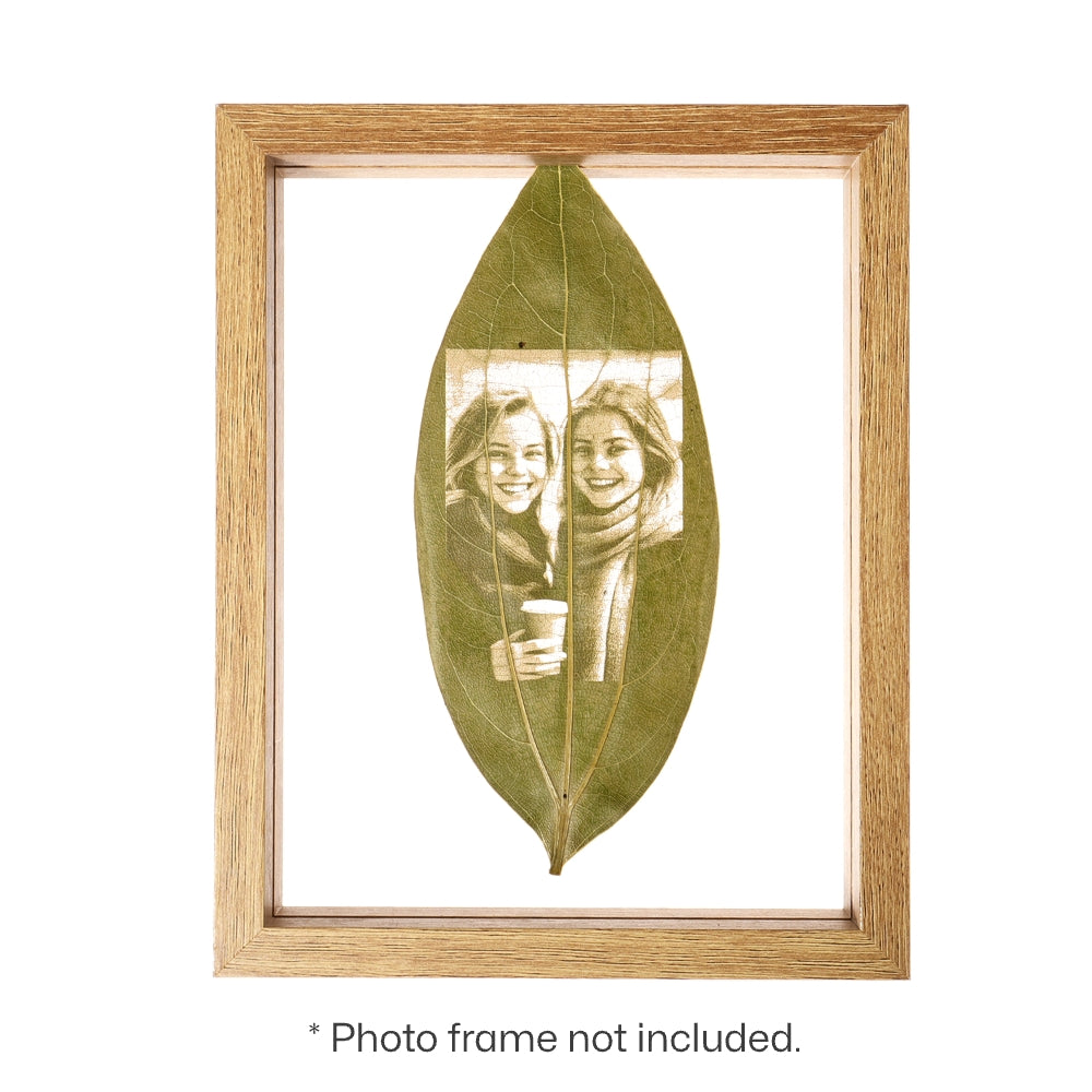 Photo Engraving on Cinnamon Leaf, framed in a wooden photo frame